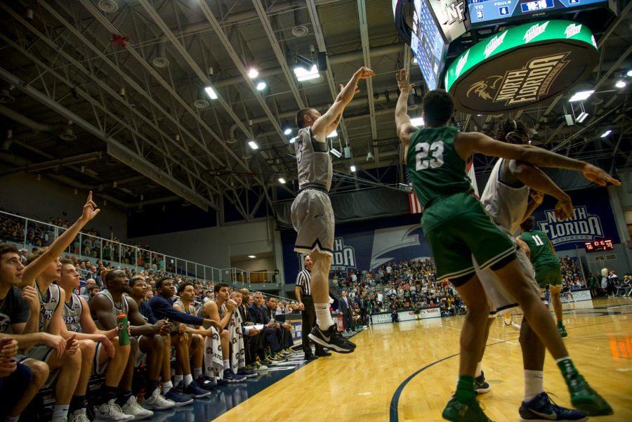 Redshirt-Junior J.T. Escobar attempts a three-pointer