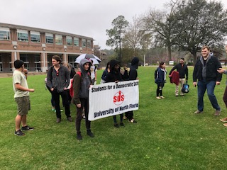 SDS marches to the Presidents Office and held their rally, even though it was raining.