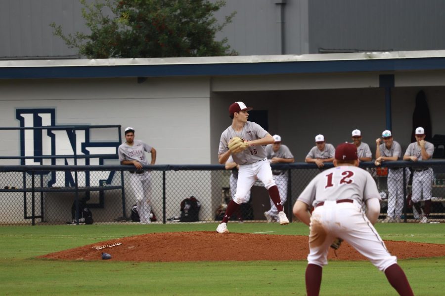 Freshman Gabriel Karslo delivers a pitch in relief.  