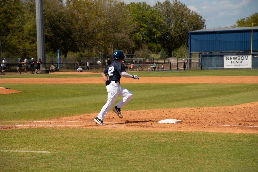 Senior Jay Prather rounds first base.