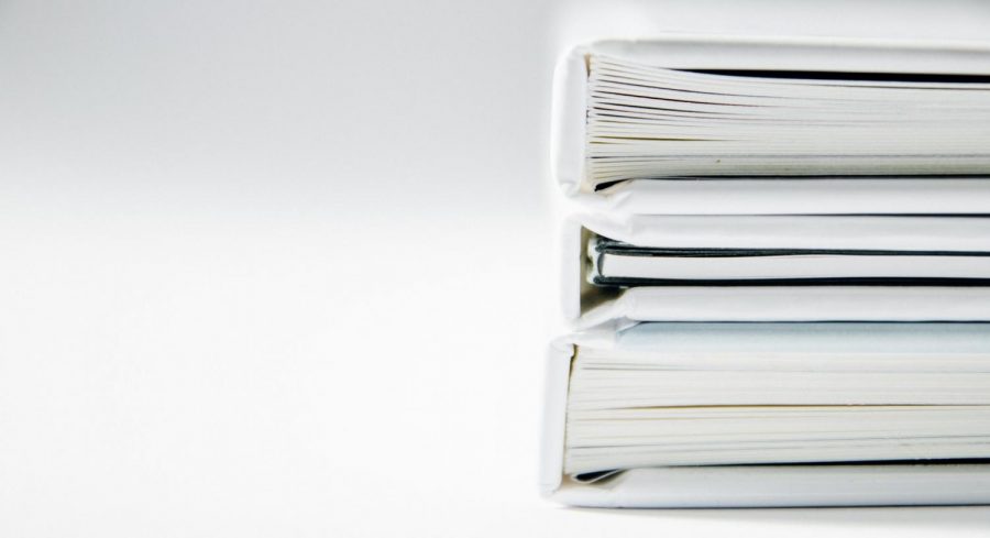 Stack of white binders