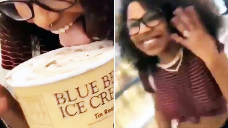 Girl licking ice cream tub