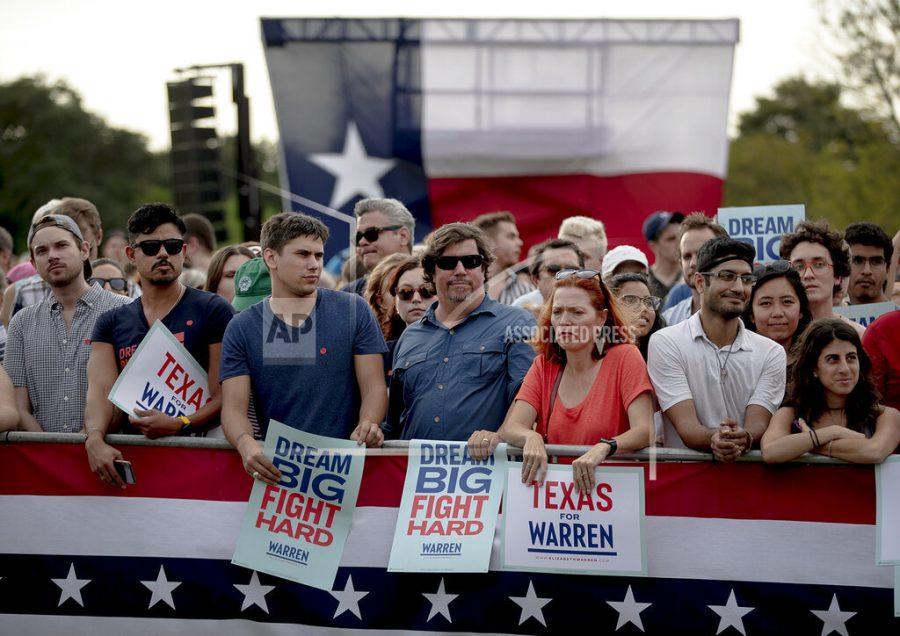 Supporters of Democratic presidential candidate Elizabeth Warren, D-Mass., wait for the candidate to appear during a town hall on Tuesday, Sept. 10, 2019, in Austin, Texas. (Nick Wagner/Austin American-Statesman via AP)