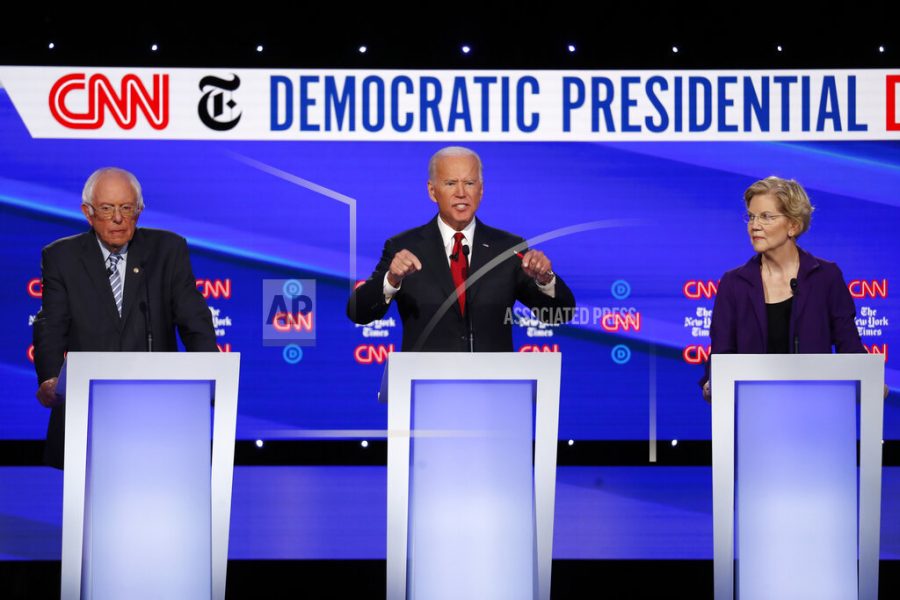 Democratic presidential candidate Sen. Bernie Sanders, I-Vt., left, former Vice President Joe Biden and Sen. Elizabeth Warren, D-Mass., right, participate in a Democratic presidential primary debate hosted by CNN/New York Times at Otterbein University, Tuesday, Oct. 15, 2019, in Westerville, Ohio. (AP Photo/John Minchillo)