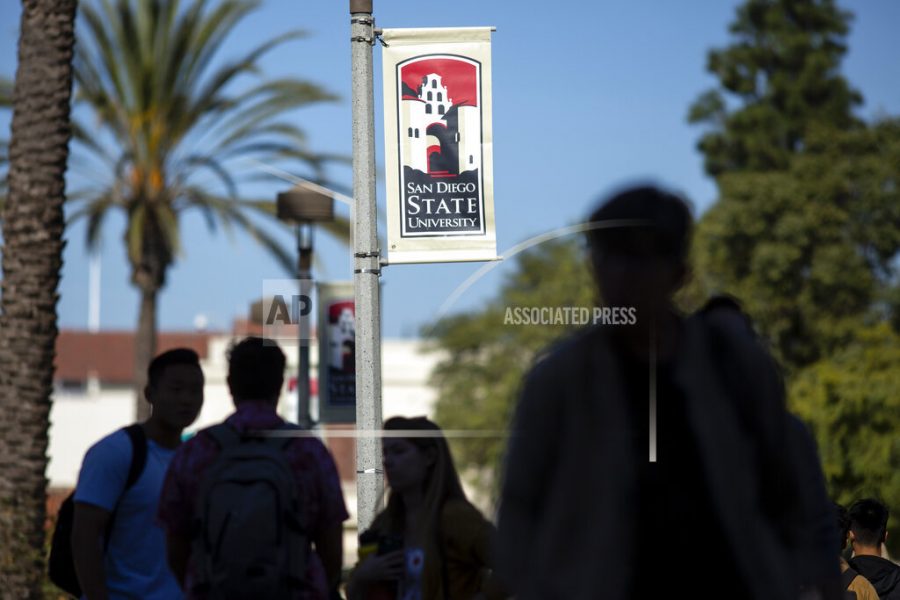 People walk on campus at San Diego State University Tuesday, Nov. 12, 2019, in San Diego, Calif. San Diego State University says a freshman who was hospitalized after attending a fraternity party last week has died. University President Adela de la Torre announced Monday that 19-year-old Dylan Hernandez died Sunday, Nov. 10, 2019 surrounded by his family.The university says its police are investigating the death but gave no further details about possible causes. (AP Photo/Gregory Bull)