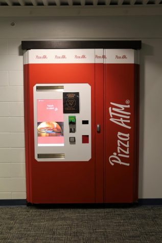 photo of red pizza vending machine inside a dorm building