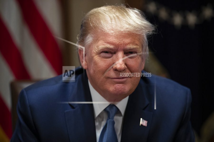 President Donald Trump smiles during a roundtable with governors on government regulations in the Cabinet Room of the White House, Monday, Dec. 16, 2019, in Washington. (AP Photo/ Evan Vucci)