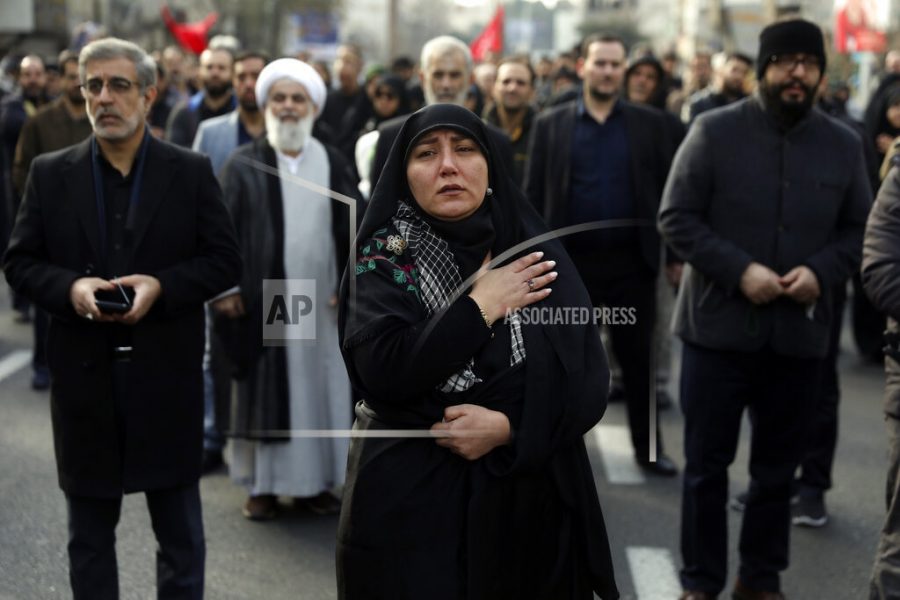 A woman mourns in a demonstration over the U.S. airstrike in Iraq that killed Iranian Revolutionary Guard Gen. Qassem Soleimani in Tehran, Iran, Jan. 3, 2020. Iran has vowed harsh retaliation for the U.S. airstrike near Baghdads airport that killed Tehrans top general and the architect of its interventions across the Middle East, as tensions soared in the wake of the targeted killing. (AP Photo/Vahid Salemi)