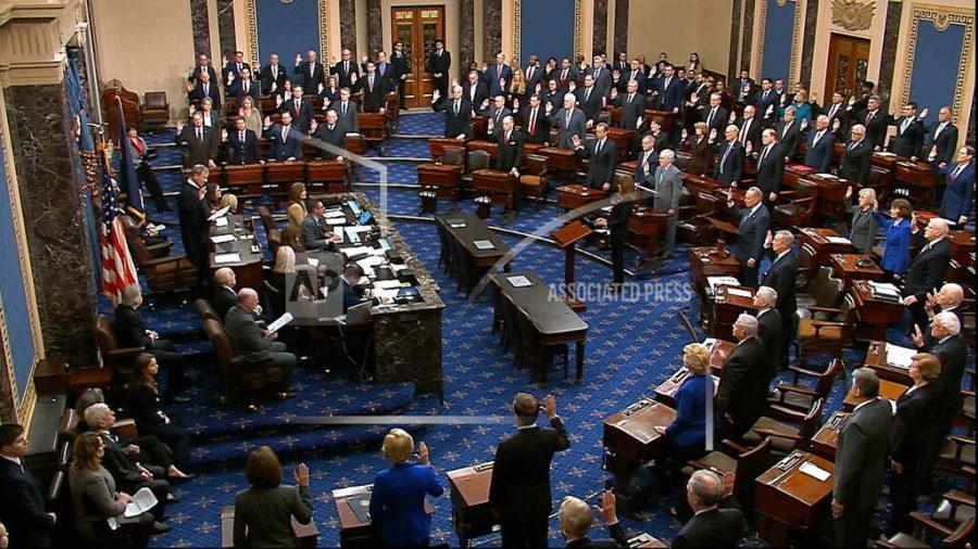 In this image from video, presiding officer Supreme Court Chief Justice John Roberts swears in members of the Senate for the impeachment trial against President Donald Trump at the U.S. Capitol in Washington, Thursday, Jan. 16, 2020. (Senate Television via AP)