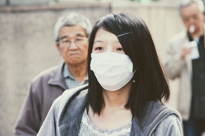 Many people in China have begun wearing face masks to limit respiratory spread of the virus.