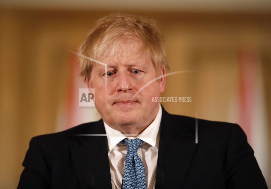 FILE - In this Tuesday, March 17, 2020 file photo British Prime Minister Boris Johnson gives a press conference about the ongoing situation with the COVID-19 coronavirus outbreak inside 10 Downing Street in London. British Prime Minister Boris Johnson has tested positive for the new coronavirus. Johnsons office said Friday March 27, 2020 that he was tested after showing mild symptoms, Downing St. says Johnson is self-isolating and continuing to lead the countrys response to COVID-19. (AP Photo/Matt Dunham, Pool)