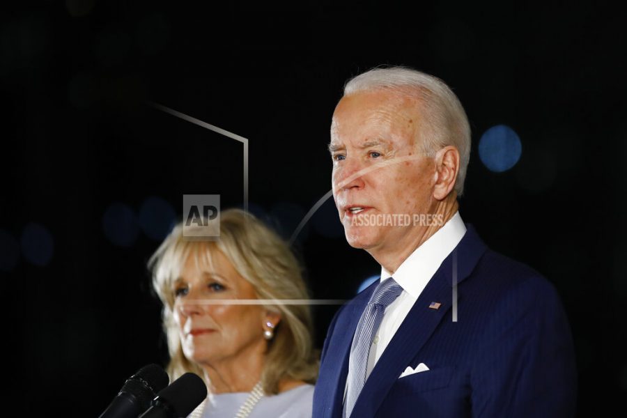 FILE - In this March 10, 2020, file photo, Democratic presidential candidate former Vice President Joe Biden, accompanied by his wife Jill, speaks to members of the press at the National Constitution Center in Philadelphia. Biden has no foreseeable plans to resume in-person campaigning amid a pandemic that is testing whether a national presidential election can be won by a candidate communicating almost entirely from home. (AP Photo/Matt Rourke)