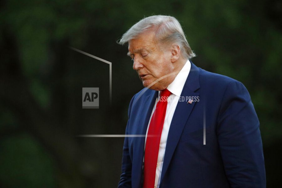 President Donald Trump walks across the South Lawn of the White House in Washington, Saturday, May 30, 2020, after stepping off Marine One as he returns from Kennedy Space Center for the SpaceX Falcon 9 launch. (AP Photo/Patrick Semansky)