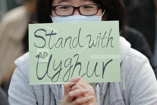 A man holds a sign during a rally to show support for Uighurs and their fight for human rights in Hong Kong. Nury Turkel, co-founder of the Uyghur Human Rights Project and former president of the Uyghur American Association, is a new member of the U.S. Commission on International Religious Freedom. Hes a leading human rights advocate on behalf of fellow Uighurs, a Muslim ethnic minority group that has seen an estimated 1 million members detained in internment camps in China. (AP Photo/Lee Jin-man, File)
