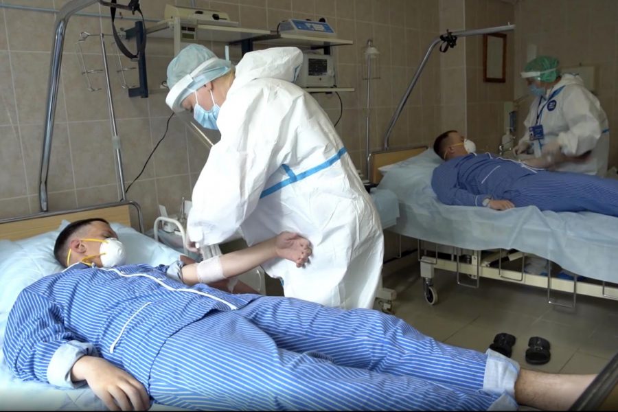 In this file photo made from footage provided by the Russian Defense Ministry on Wednesday, July 15, 2020, medical workers in protective gear prepare to draw blood from volunteers participating in a trial of a coronavirus vaccine at the Budenko Main Military Hospital outside Moscow, Russia. Putin says that a coronavirus vaccine developed in the country has been registered for use and one of his daughters has already been inoculated. Speaking at a government meeting Tuesday, Aug. 11, 2020, Putin said that the vaccine has proven efficient during tests, offering a lasting immunity from the coronavirus. (Russian Defense Ministry Press Service via AP, File)