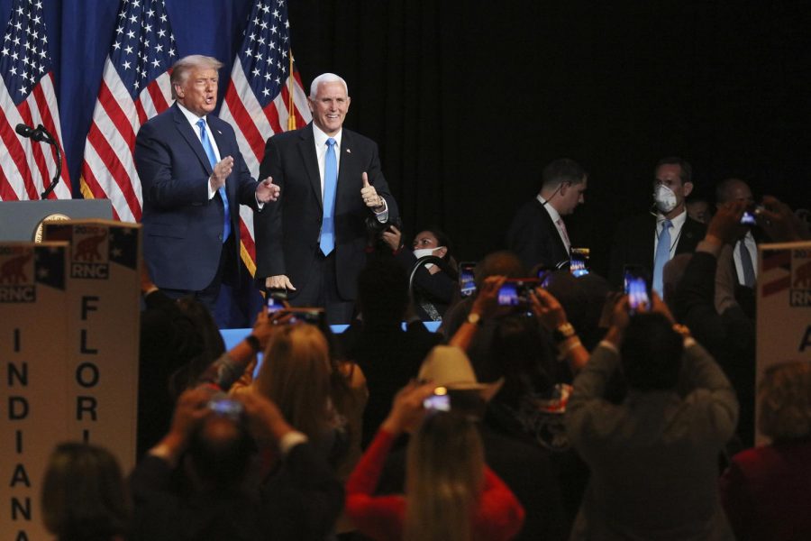 President Donald Trump and Vice President Mike Pence give a thumbs up after speaking during the first day of the Republican National Convention Monday, Aug. 24, 2020, in Charlotte, N.C. (Travis Dove/The New York Times via AP, Pool)