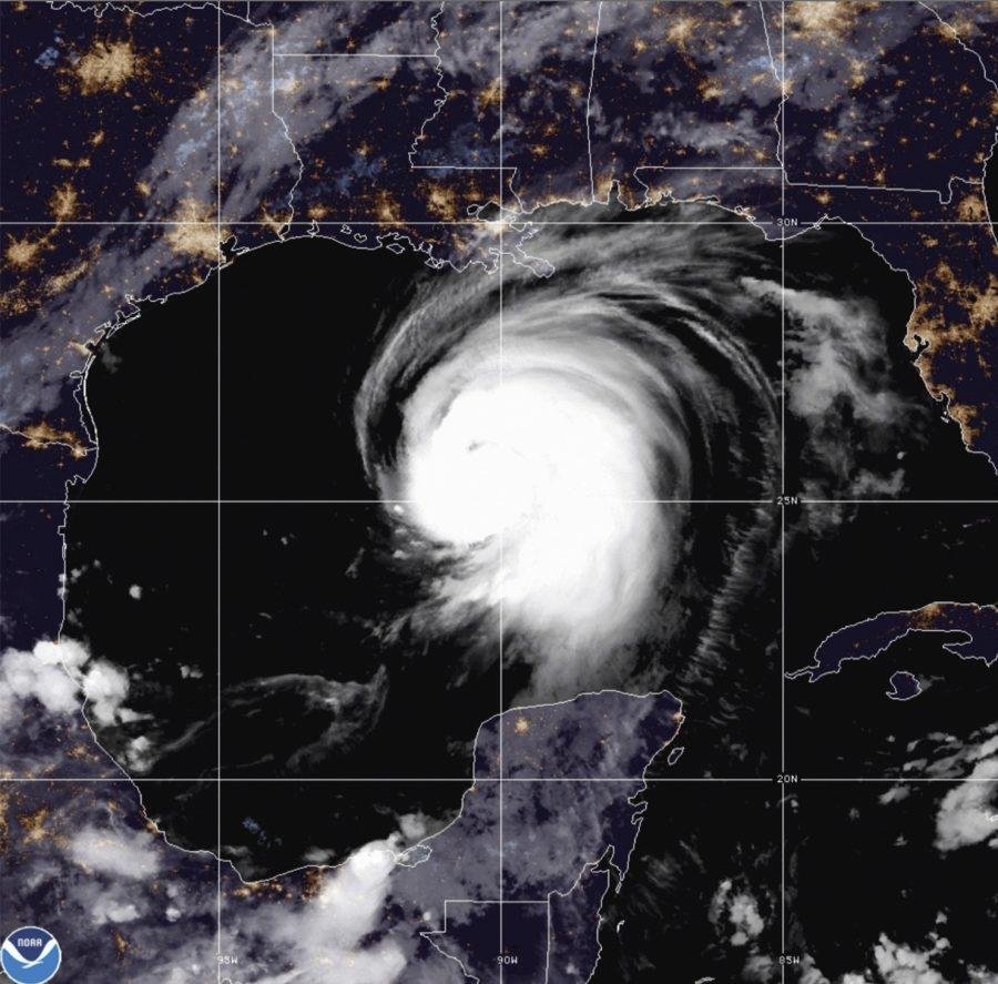 This satellite image released by the National Oceanic and Atmospheric Administration (NOAA) shows Hurricane Laura churning in the Gulf of Mexico, Wednesday, Aug. 26, 2020.  Forecasters say Laura is rapidly intensifying and will become a “catastrophic” Category 4 hurricane before landfall.  (NOAA via AP)