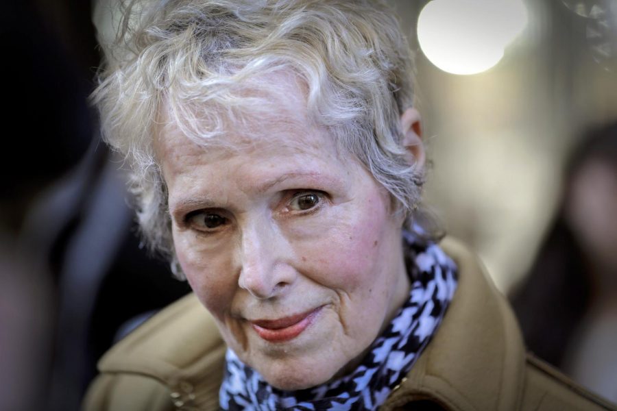 FILE - In this March 4, 2020, photo, E. Jean Carroll talks to reporters outside a courthouse in New York. The U.S. Justice Department is seeking to take over President Donald Trumps defense in a defamation lawsuit brought by Carroll, who accused the president of raping her in a New York luxury department store in the mid-1990s. Federal lawyers asked a court Tuesday, Sept. 8, 2020, to allow a legal move that could put the American people on the hook for any money she might be awarded. She says the presidents comments, including that she was “totally lying” to sell a memoir, besmirched her character and harmed her career when he denied the rape allegations in 2019. (AP Photo/Seth Wenig, File)