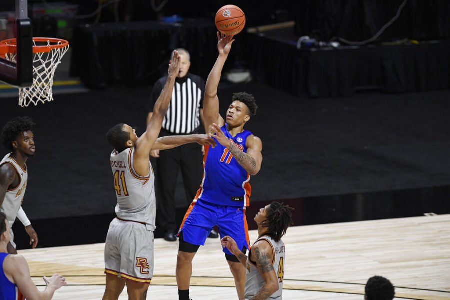 Floridas Keyontae Johnson shoots over Boston Colleges Steffon Mitchell (41) during the second half of an NCAA college basketball game Thursday, Dec. 3, 2020, in Uncasville, Conn. (AP Photo/Jessica Hill)