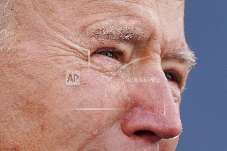 President-elect Joe Biden tears up as he speaks at the Major Joseph R. Beau Biden III National Guard/Reserve Center, Tuesday, Jan. 19, 2021, in New Castle, Del. (AP Photo/Evan Vucci)