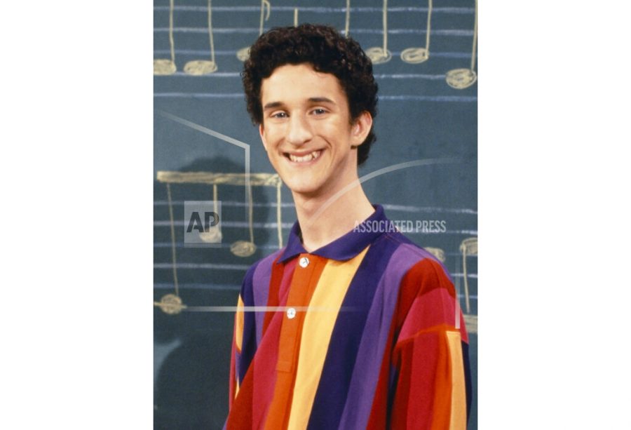 This image released by NBC shows actor Dustin Diamond as Samuel Powers, better known as Screech from the 1990s series Saved by the Bell. Diamond died Monday after a three-week fight with carcinoma, according to his representative. He was 44. Diamond was hospitalized last month in Florida and his team disclosed later he had cancer. (Paul Drinkwater/NBCU Photo Bank via AP)