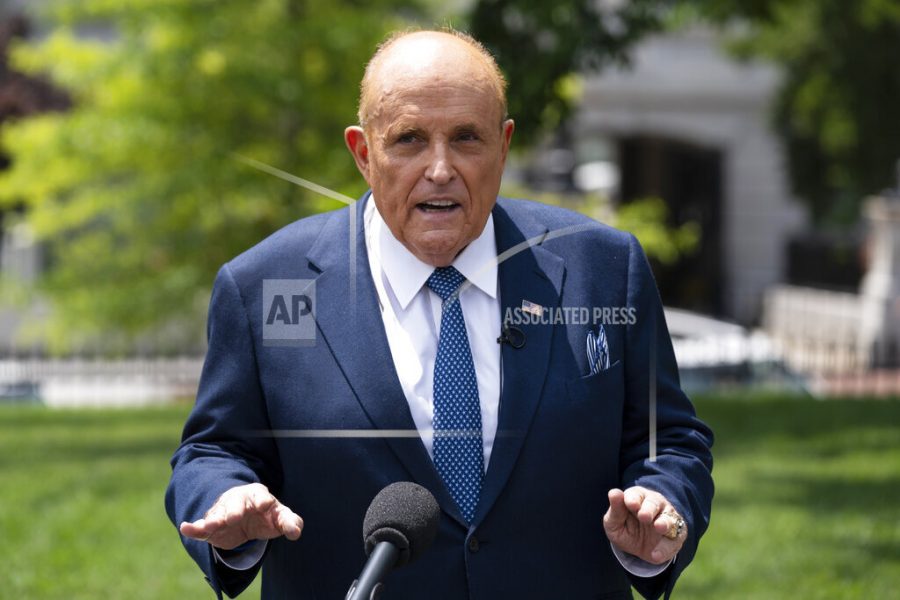 FILE - Rudy Giuliani, a personal attorney for President Donald Trump, talks with reporters outside the White House, Wednesday, July 1, 2020, in Washington. A voting technology company is suing Fox News, three of its top hosts, Giuliani and Sidney Powell for $2.7 billion, charging that the defendants conspired to spread false claims that the company helped steal the U.S. presidential election away from former President Donald Trump. (AP Photo/Evan Vucci, File)