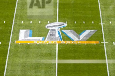 Detail view of Super Bowl LV logo on the field from an elevated position before Super Bowl 55 NFL football game against the Kansas City Chiefs and the Tampa Bay Buccaneers on Sunday, Feb. 7, 2021 in Tampa, Fla. (Ric Tapia via AP)
