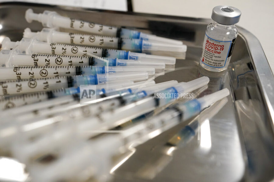 FILE - This Thursday, March 18, 2021 file photo shows syringes filled with the Moderna COVID-19 vaccine at a pop up site in the Queens borough of New York.  According to results released on Monday, March 29, 2021, The U.S government’s first look at the real-world use of COVID-19 vaccines found their effectiveness was nearly as robust as it was in controlled studies. (AP Photo/Mary Altaffer)