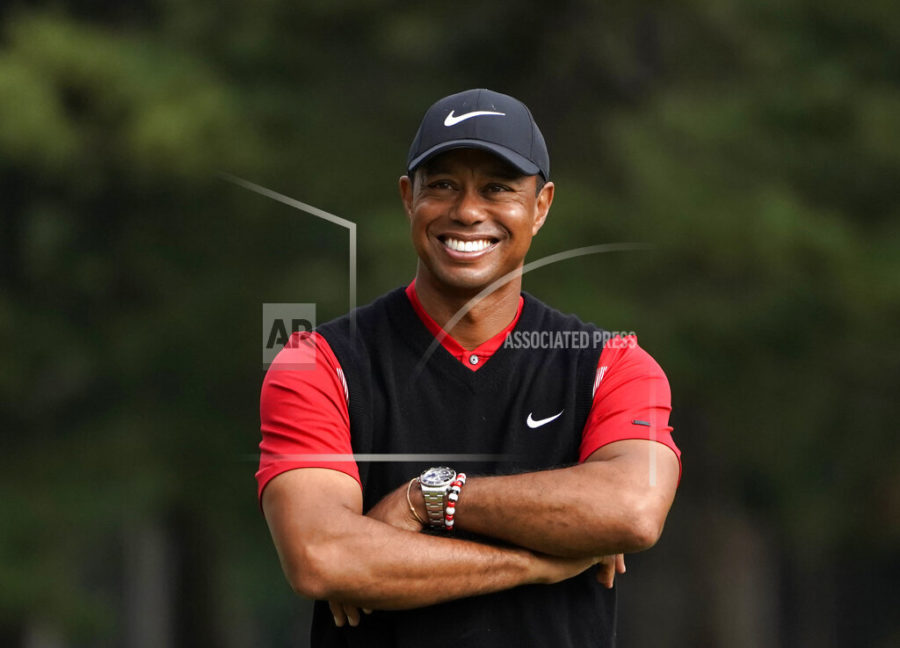 FILE - In this Oct. 28, 2019, file photo, Tiger Woods smiles during the winners ceremony after winning the Zozo Championship PGA Tour at the Accordia Golf Narashino country club in Inzai, east of Tokyo, Japan. A man who found Woods unconscious in a mangled SUV last week after the golf star who later told sheriffs deputies he did not know how the collision occurred and didnt even remember driving, crashed the vehicle in Southern California, authorities said in court documents. Law enforcement has not previously disclosed that Woods had been unconscious following the collision.  (AP Photo/Lee Jin-man, File)