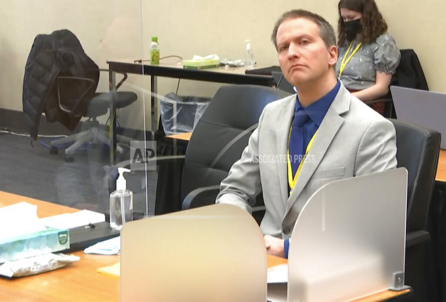 In this image from video, former Minneapolis police Officer Derek Chauvin listens as his defense attorney Eric Nelson gives closing arguments as Hennepin County Judge Peter Cahill preside Monday, April 19, 2021, in the trial of Chauvin at the Hennepin County Courthouse in Minneapolis. Chauvin is charged in the May 25, 2020 death of George Floyd.  (Court TV via AP, Pool)