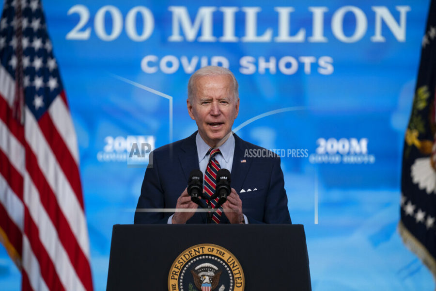 FILE - In this April 21, 2021, file photo, President Joe Biden speaks about COVID-19 vaccinations at the White House, in Washington. Biden spent his first 100 days encouraging Americans to mask up and stay home to slow the spread of COVID-19. His task for the next 100 will be to encourage the opposite behavior and manage the nation’s transition back to normalcy. (AP Photo/Evan Vucci, File)