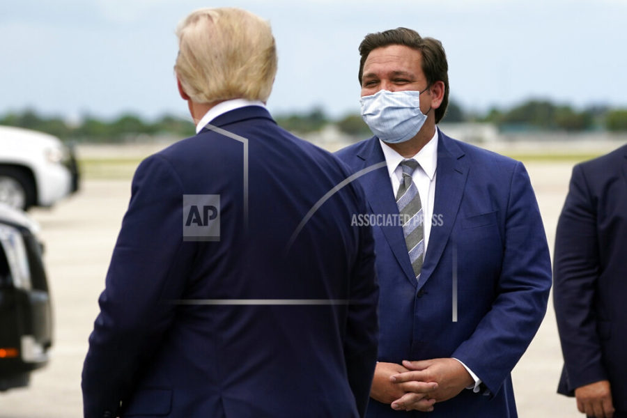 FILE - In this Sept. 8, 2020, file photo President Donald Trump greets Florida Gov. Ron DeSantis as he arrives at West Palm Beach International Airport in West Palm Beach, Fla. Now that the pandemic appears to be waning and DeSantis is heading into his reelection campaign next year, he has emerged from the political uncertainty as one of the most prominent Republican governors and an early White House front-runner in 2024 among Donald Trumps acolytes, if the former president doesnt run again. (AP Photo/Evan Vucci, File)