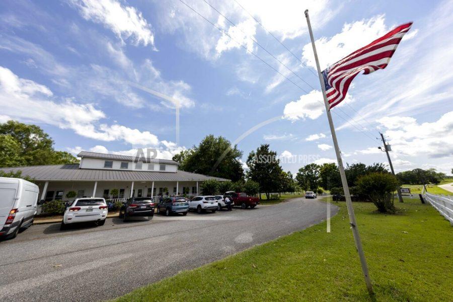The Us Flag flies at half mast Sunday, June 20, 2021, in Camp Hill, Ala.,  at the Alabama Sheriffs Girls Ranch which suffered a loss of life when their van was involved in a multiple vehicle accident Saturday, resulting in eight people in the van perishing. (AP Photo/Vasha Hunt)