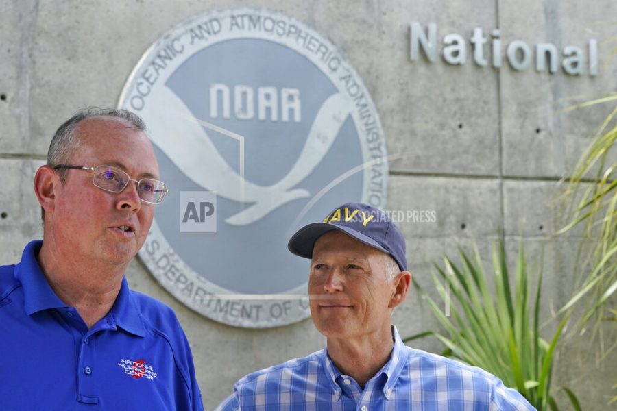 National Hurricane Center director Ken Graham, left, speaks during a news conference along with Sen. Rick Scott, R-Fla.,Tuesday, June 1, 2021, at the center in Miami. Tuesday marks the start of the 2021 Atlantic hurricane season which runs to Nov. 30. (AP Photo/Wilfredo Lee)