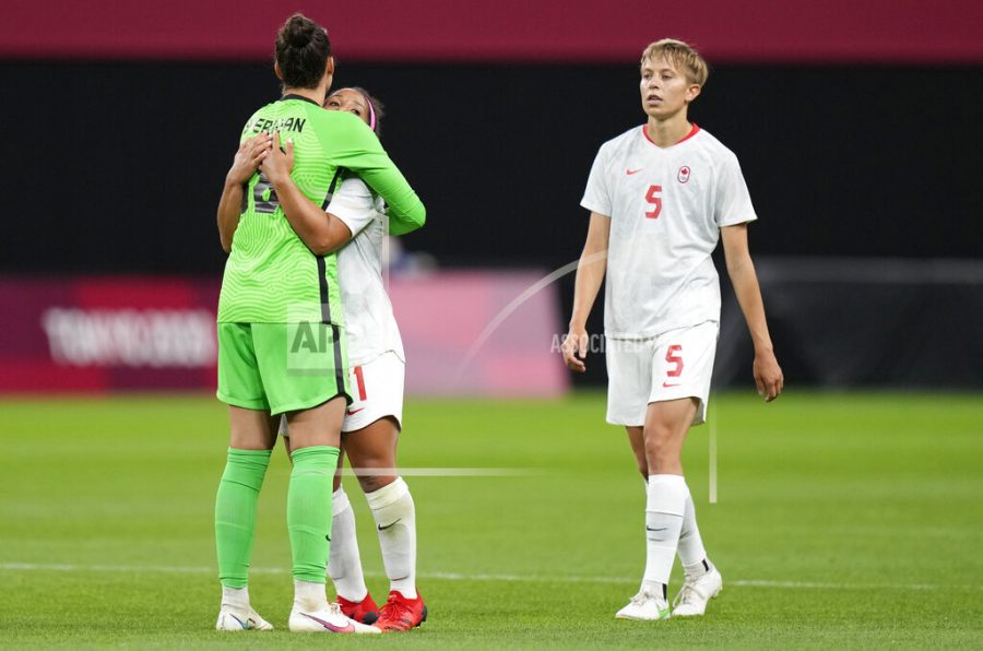 Canadas Quinn, right, leaves the field celebrate at the end of a womens soccer match against Chile at the 2020 Summer Olympics, Saturday, July 24, 2021, in Sapporo, Japan. Canada won 2-1.(AP Photo/Silvia Izquierdo)