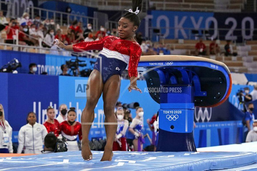 Simone Biles, of the United States, lands from the vault during the artistic gymnastics womens final at the 2020 Summer Olympics, Tuesday, July 27, 2021, in Tokyo. (AP Photo/Gregory Bull)