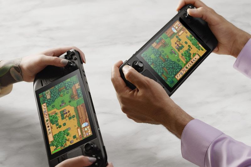 Clash of the new gaming handhelds: Nintendo Switch (OLED model) vs. Steam Deck
