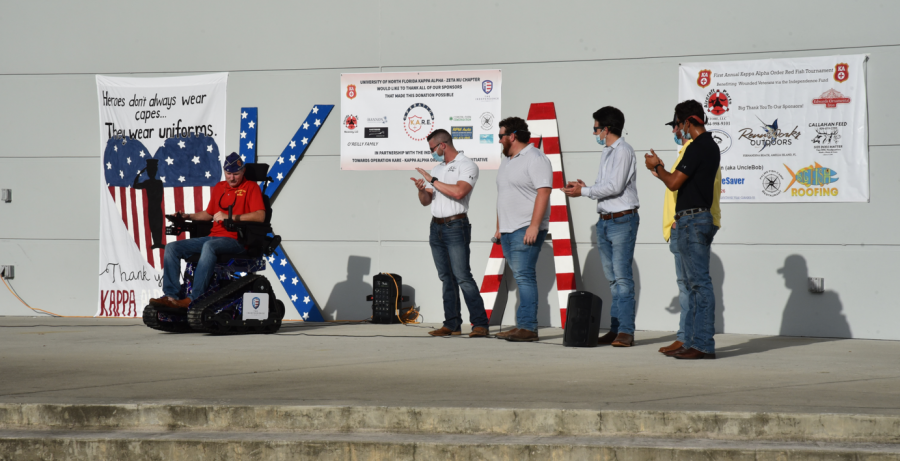 UNF Kappa Alpha fraternity gifts track chair to disabled veteran