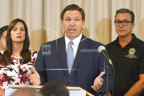 Florida Governor Ron DeSantis answers questions related to school openings and the wearing of masks, Tuesday, Aug. 10, 2021, in Surfside, Fla. (AP Photo/Marta Lavandier)