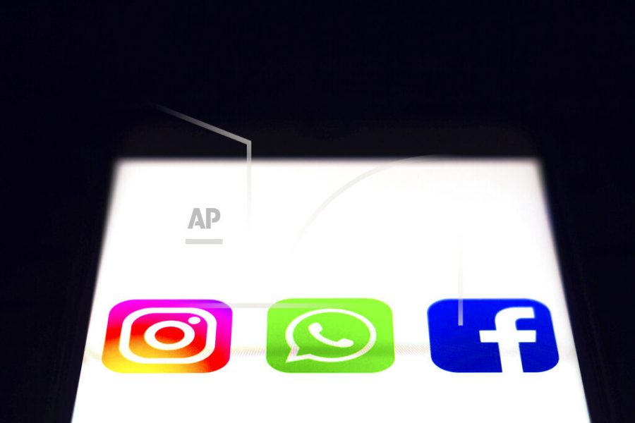 In this photo illustration the icon Instagram, WhatsApp and Facebook apps seen displayed on a smartphone. (Photo by Rafael Henrique / SOPA Images/Sipa USA)(Sipa via AP Images)