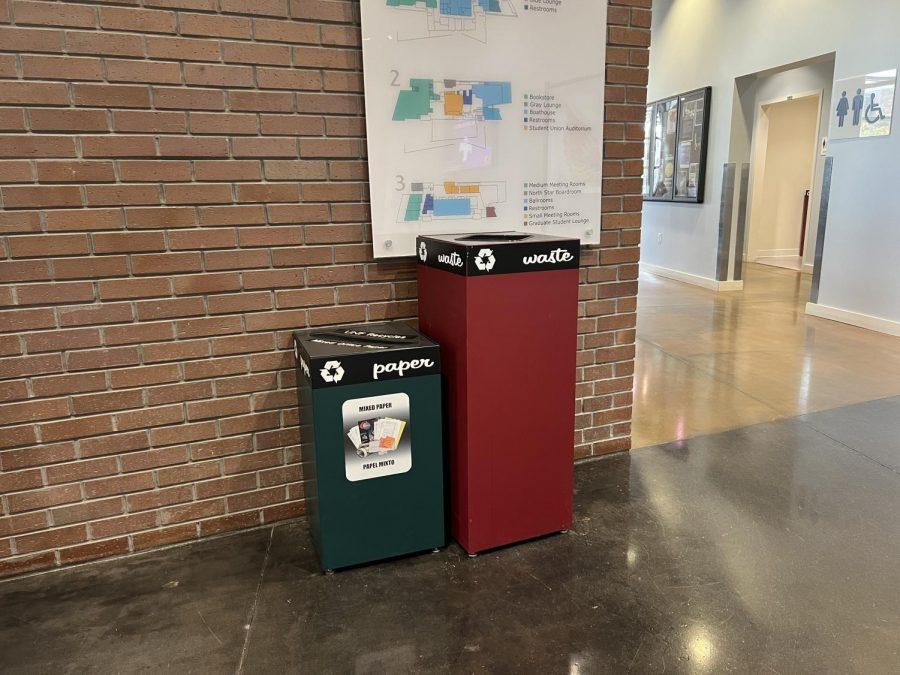 Waste and paper bins stand inside the Student Union. 