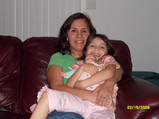 Jean Dahlia, as a child, with her beloved “mom” (great aunt) holding her baby doll.