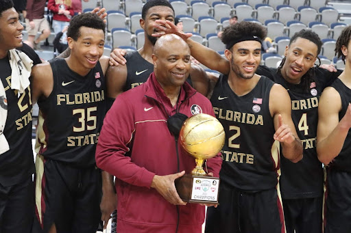 Florida State head coach Leonard Hamilton celebrates with his team after winning the Duval Bracket.