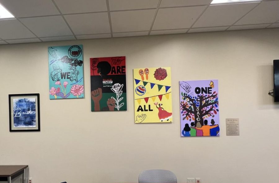 Shekinah Mitchell’s mural ‘We Are All One’ hangs on the wall in the Intercultural Center’s lounge. 