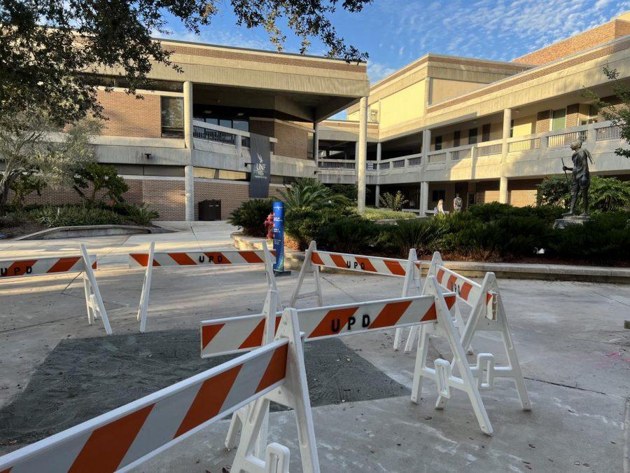 A square portion of the sidewalk in front of the Gandhi statue in the middle of UNF’s campus is cordoned off by UPD barricades. On the evening of Nov. 28, students, faculty, and staff were notified that water in certain areas of the campus was no longer potable for the time being. 