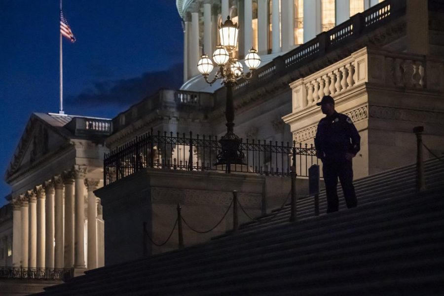 Night falls at the the Capitol in Washington, Thursday, Dec. 2, 2021, with the deadline to fund the government approaching. Republicans in the Senate are poised to stall a must-pass funding bill as they force a debate on rolling back the Biden administrations COVID-19 vaccine mandates for some workers. (AP Photo/J. Scott Applewhite)