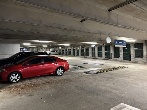 Parked cars sit on the bottom floor of the Fine Arts Center Parking Garage (Building 44).
