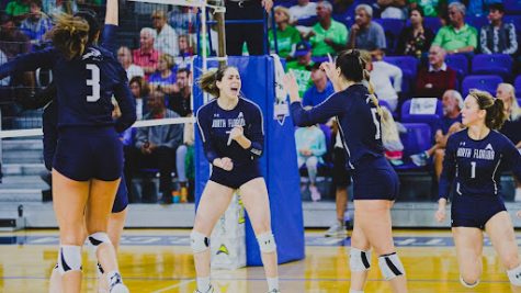 Solimar Cestero (7), Julianna Askew (5), and teammates celebrate after a kill during the ASUN tournament. Photo by Jeremiah Wilson.