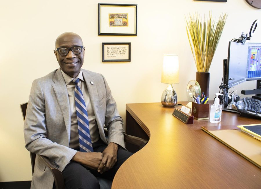 Dr. Richmond Wynn sits in front of his desk in the Counseling Center.