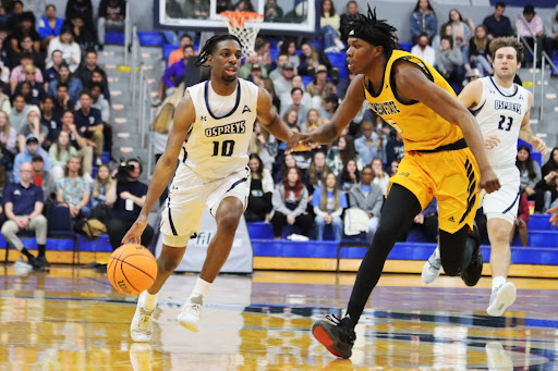 UNF Guard Jarius Hicklen #10 driving down the court against Kenneshaw State on January 17th, 2022 at UNF Arena in Jacksonville, Florida.